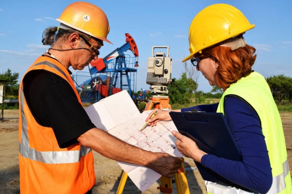 Engineers working in oilfield